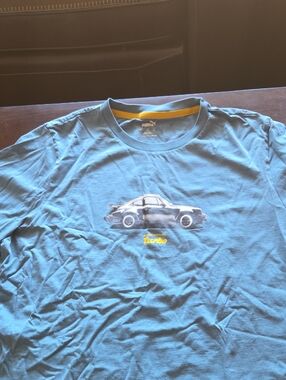 Puma Light Blue Tee with Yellow Accent and Car Graphic Puma Porsche Legacy